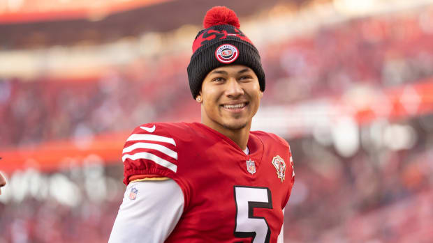 49ers quarterback Trey Lance (5) smiles after defeating the Falcons.